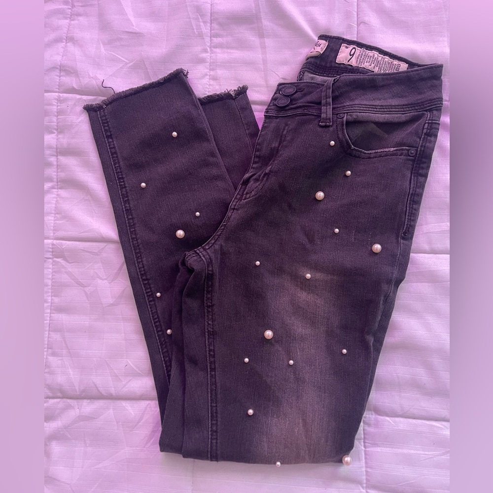 Black washed jeans with pearls.